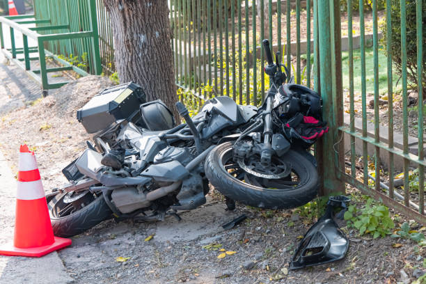 istock Fragments of a broken motorcycle on the pavement. 2180906684