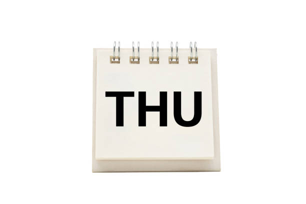 Written word reminders marked on a paper calendar with a color pen marker on workers day saying relax