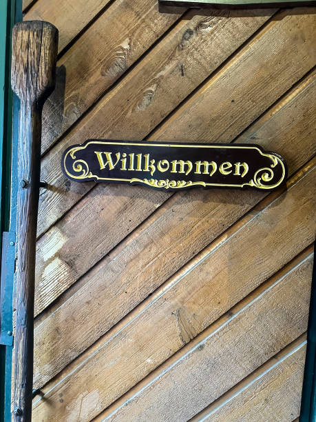 istock Willkommen sign on door of German restaurant 2180911368