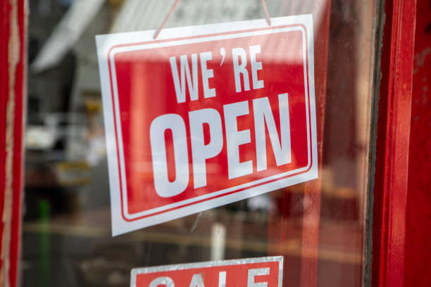 istock Open sign in a shop door window 2180913574