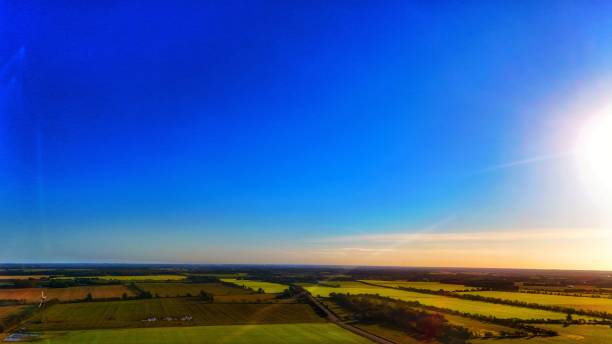 istock Aerial view of green fields and vibrant sky. 2180915252