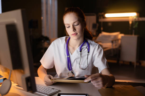 istock Physician looks through medical data on her computer, ensuring thorough patient care 2180917767