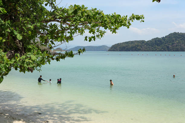 Langkawi, Malaysia March 12, 2024: Tour group with beautiful scenery at Pulau Beras Basah, DXN Beras Basah as part of an island hopping tour.