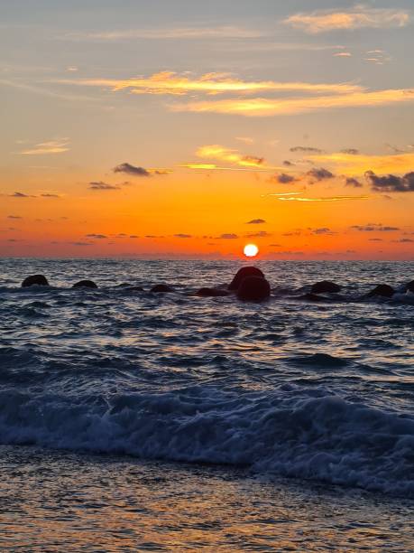 istock sunset over the calm sea on a beautiful day 2180920951