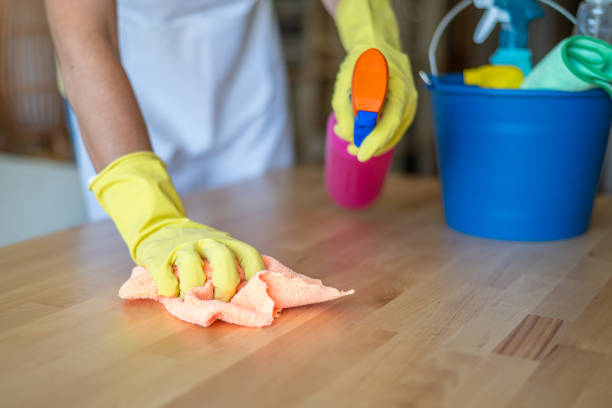 istock Professional Home Cleaning Service Concept With Cleaning Supplies And Worker In Protective Gloves Wiping Surface With Cloth.Home Cleaning Concept 2180922115
