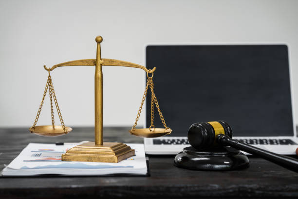istock A lawyer's desk in an office,with legal documents, computers, and hammers placed neatly.The setting is organized for legal consulting services, contract reviews,will drafting,document certification 2180923518
