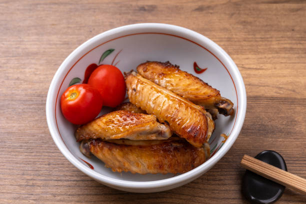 istock Oven-baked chicken wings marinated in soy sauce and koji 2180927551