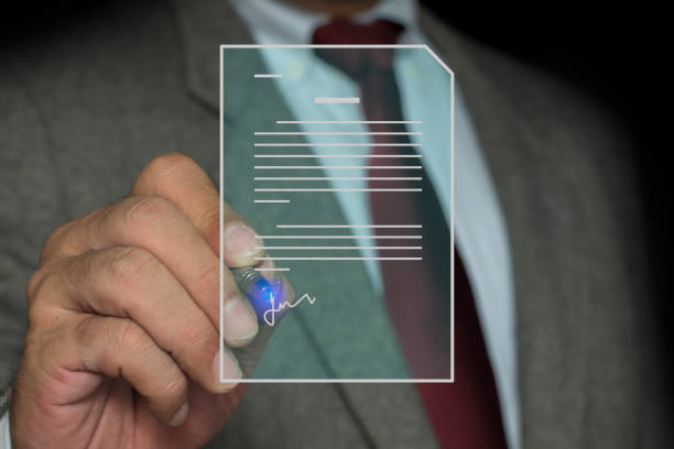 Signing business contract, Electronic Signing Businessman signs electronic documents on digital documents on virtual laptop screen using stylus pen. digital document management, paperless office