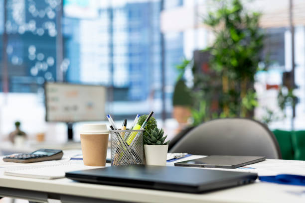 istock Close up on laptop in empty financial department office 2180931776