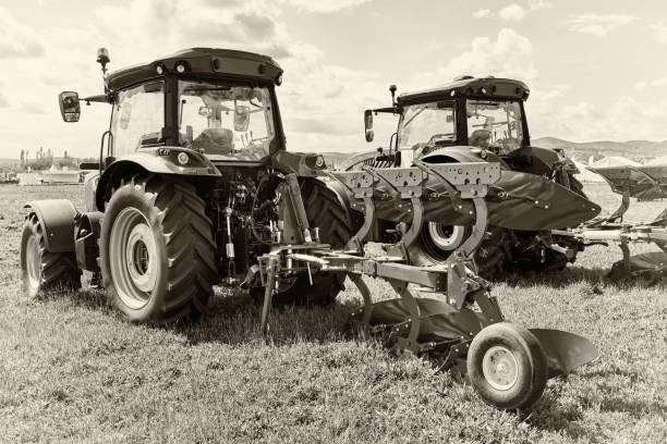 istock Tractors with plough for agricultural 2180932274