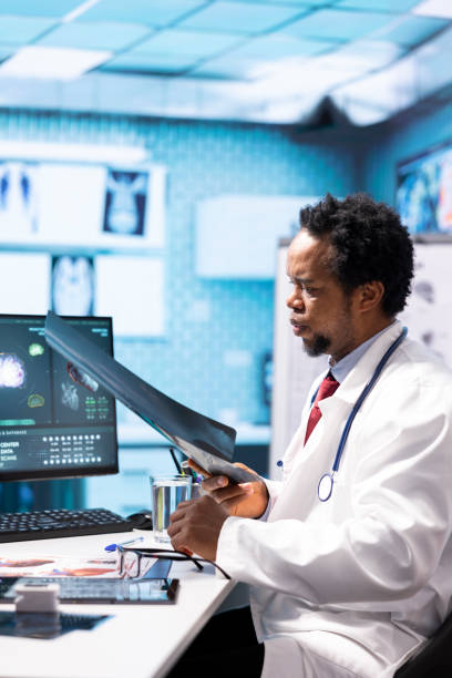 istock Doctor reading x ray imaging for a diagnostic report at consultation 2180932402