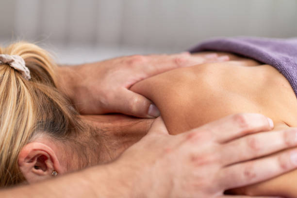 istock Physical therapist performs a deep tissue massage on a patients shoulder to relieve muscle tension and improve mobility in a therapeutic setting 2180932421