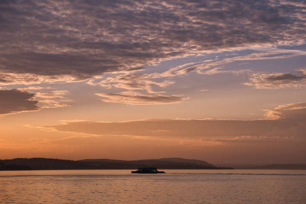 Yacht in the port and the sunset in the background