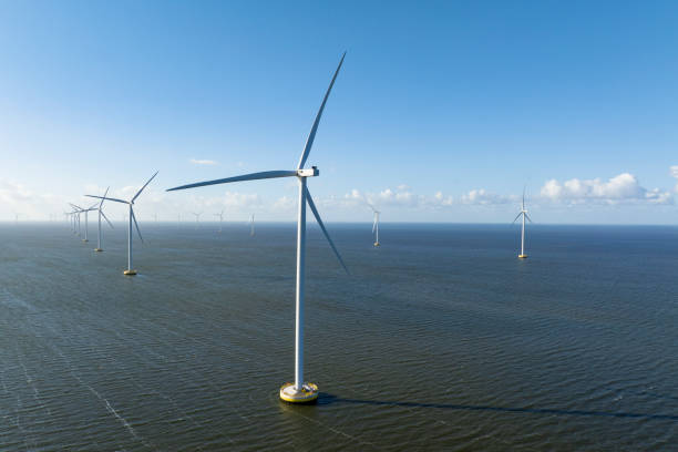 istock Wind turbines in an offshore wind park producing electricity 2180944480