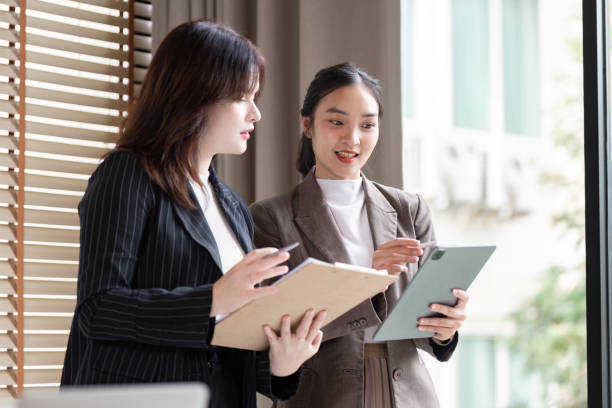 istock Business Analysts Collaborating on Digital Strategies with Tablet Devices 2180944492