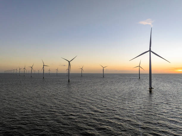 istock Wind turbines in an offshore wind park producing electricity 2180944532