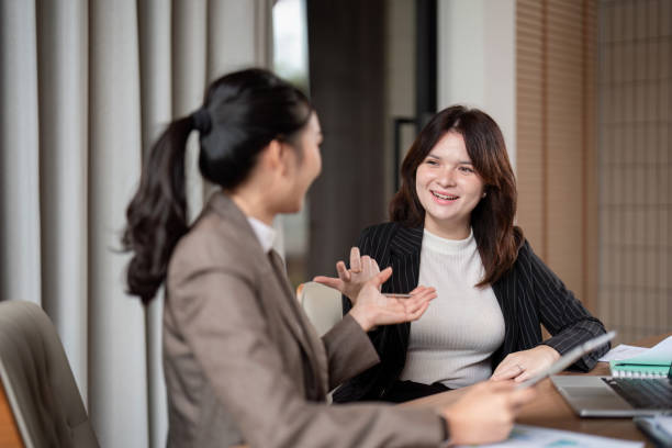 istock Professional Dialogue Between Businesswoman and Consultant in Office Setting 2180944584