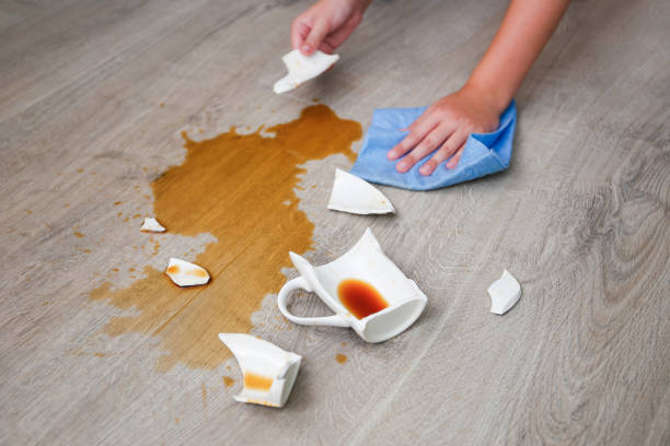 istock A broken cup of coffee fell on laminate, coffee spilled on floor. 2180945119