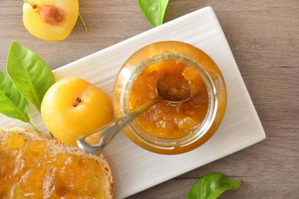 istock Plum jam and pieces of fruit on a white plate 2180945279