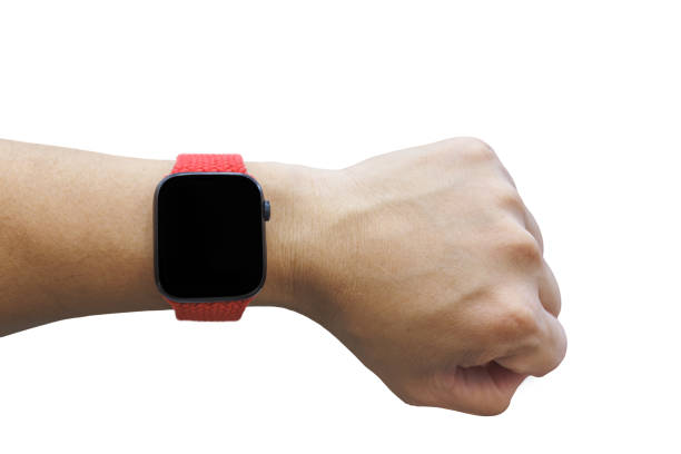 istock Man hand wearing smart watch with red lace and blank empty watch face screen for application mockup isolated cutout in white background. 2180945480