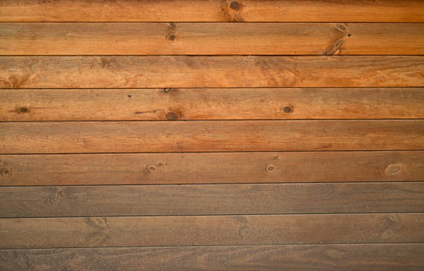 istock siding is in the form of a wooden log wall. background 2180945876