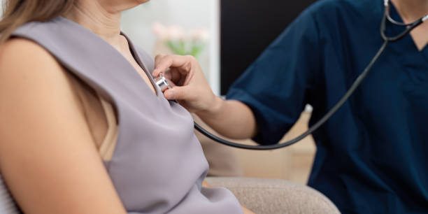 istock Medical Professional Using Stethoscope to Examine Patient During Routine Check-Up in Modern Clinic 2180947632