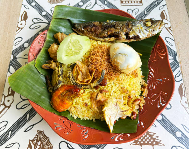 istock Nasi Kuning (yellow rice and side dishes) is eaten during celebrations in Bali, Indonesia. 2180948094