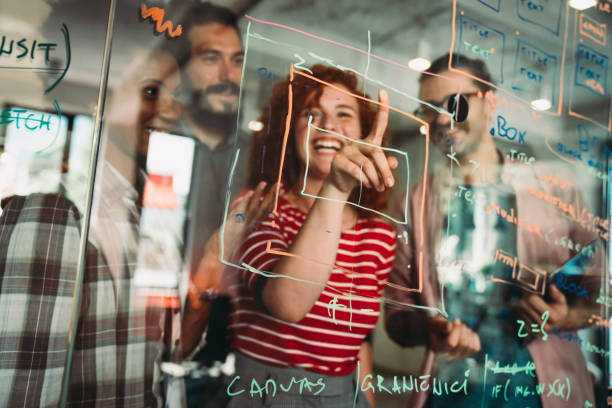 istock Group of business people and software developers working as a team in office 2180950478