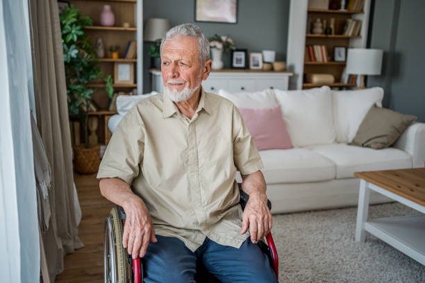 istock Senior man in a wheelchair at his home 2180952862