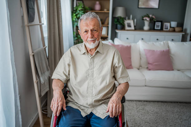 istock Senior man in a wheelchair at his home 2180953475