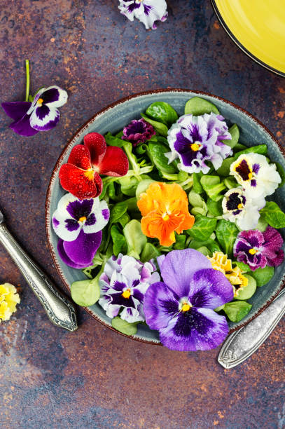 istock Colorful edible flower salad. 2180954133