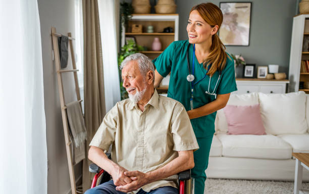 istock Senior man with home caregiver 2180954149