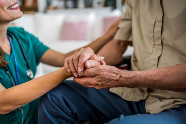 istock Senior man being supported by his nurse 2180954225