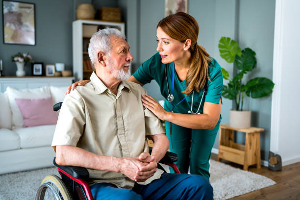 istock Senior man with home caregiver 2180954272