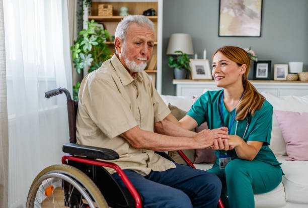 istock Home nurse caring for her elderly patient 2180954412