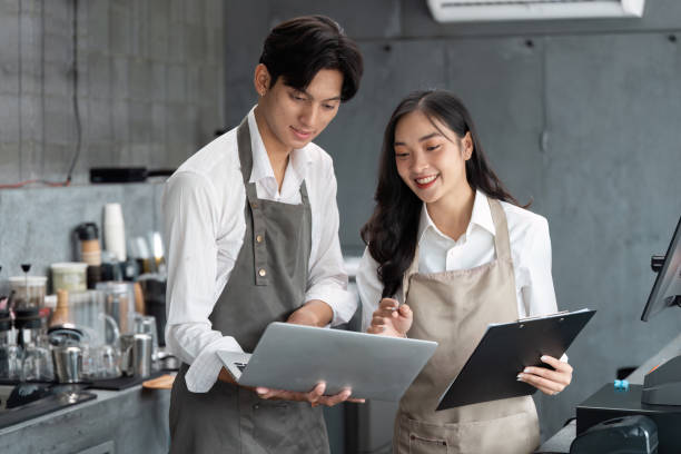 Young entrepreneur Discussing Business strategy in a Modern Coffee Shop Setting