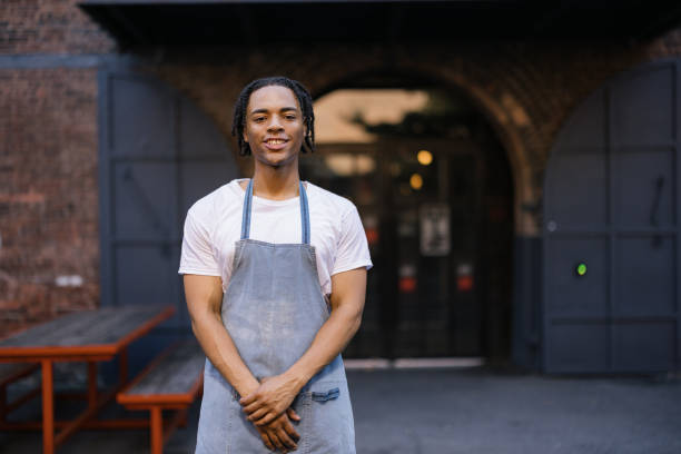 istock Happy black man in front of a coffee shop. 2180958984