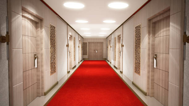 istock A long hallway with a red carpet leads to a closed double doors at the end. 3D illustration 2180961901