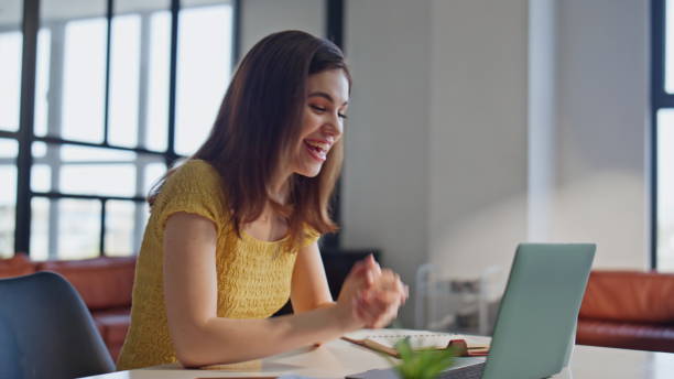 istock Online tutor talking laptop web camera in home office closeup. Positive woman 2180963880