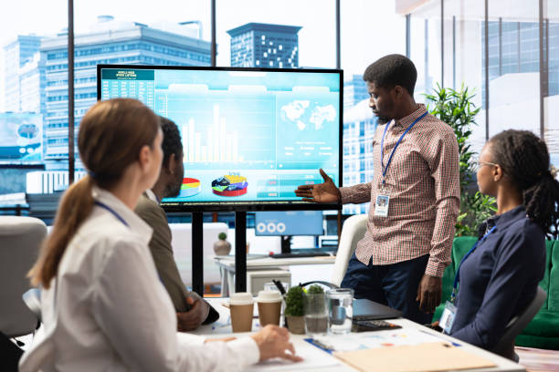istock Company workers in high end office space collaborating on project management 2180963964