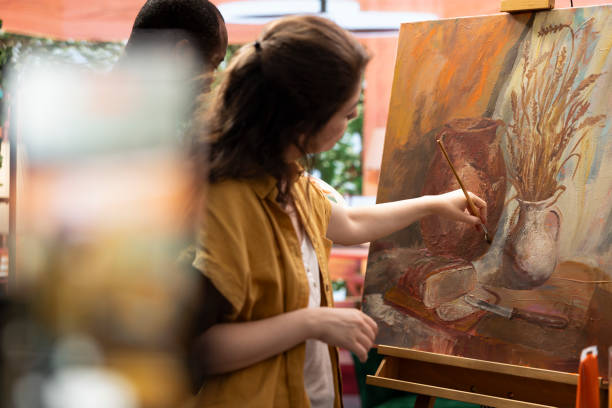 istock Diverse team of painters recording a video for online class lesson 2180964281