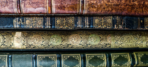 Vintage ornate book spines with intricate designs.