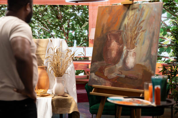 istock African american artist using his skill to paint a new creation in art studio 2180966285