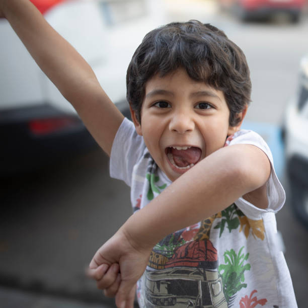 Child laughing in the street