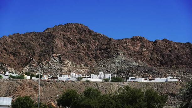 istock Mountain Village Daytime Horizontal Blue Brown White 2180966963