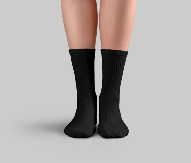istock Mockup of black long socks on women's slender legs, front view, for design, branding, pattern. 2180973107