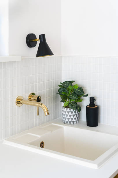istock Modern kitchen corner with stylish gold faucet and white sink 2180973516