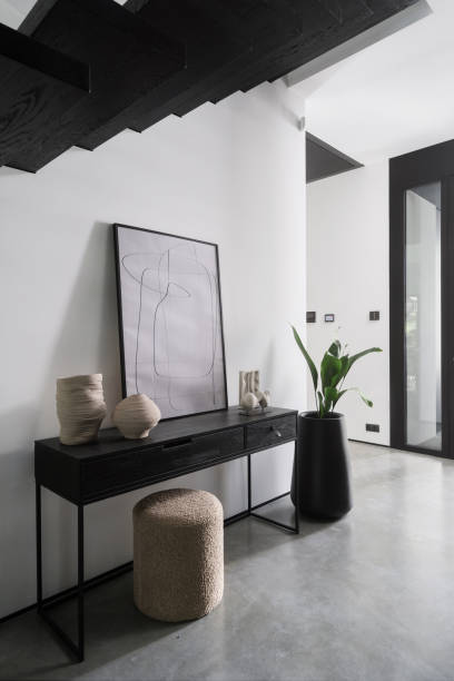 istock Modern minimalist hallway with sleek console table and artistic decor in contemporary home 2180973549