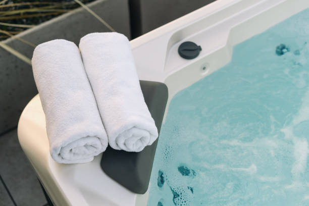 White towel on the edge of hot bath
