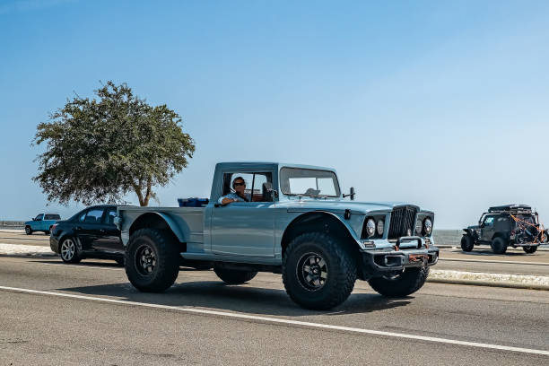 Gulfport, MS - October 04, 2023: Wide angle front corner view of a 1967 Kaiser Jeep M715 Custom Pickup Truck at a local car show.